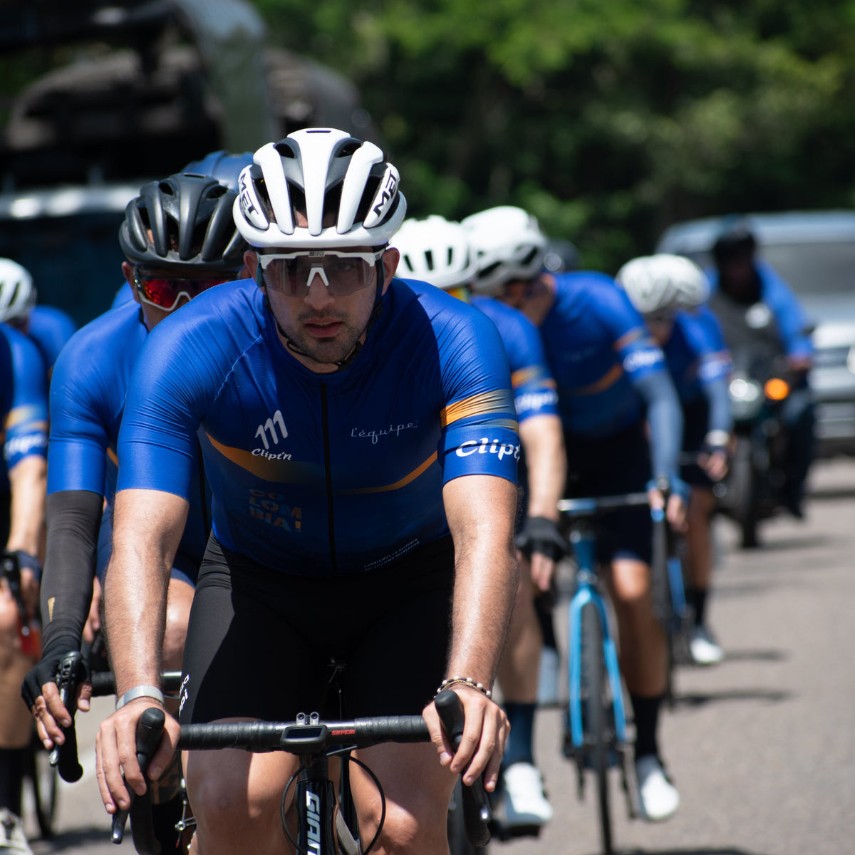 Cyclists riding together in a road-racing peloton